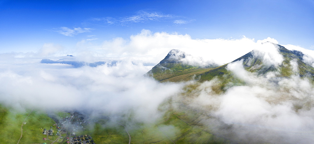 Aerial panoramic of clouds above Gjogv, Eysturoy island, Faroe Islands, Denmark, Europe