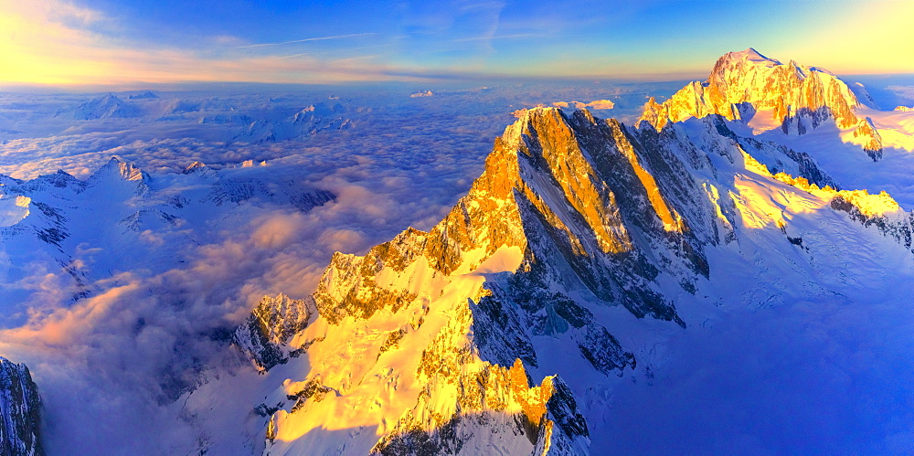 Aerial panoramic of Grandes Jorasses, Petites Jorasses and Mont Blanc at sunrise, Courmayeur, Aosta Valley, Italy, Europe