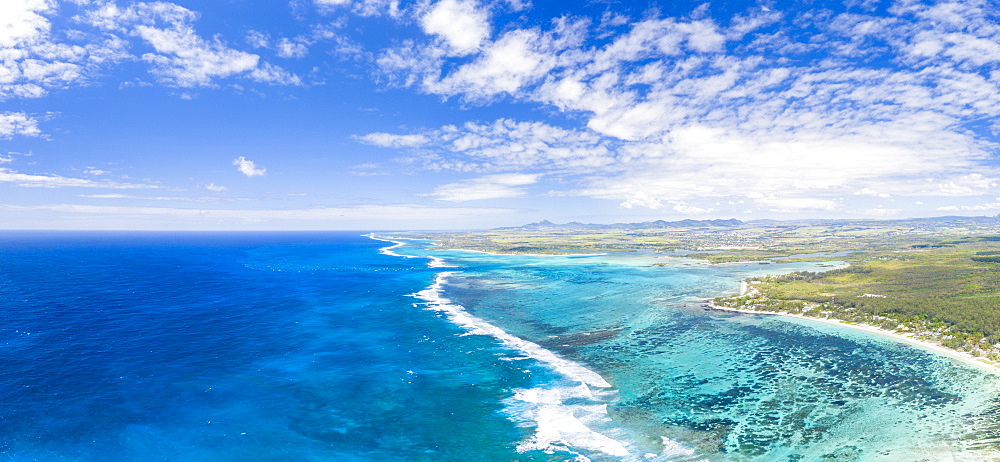 Aerial panoramic of waves of Indian Ocean and turquoise coral reef, Poste Lafayette, East coast, Mauritius, Indian Ocean, Africa