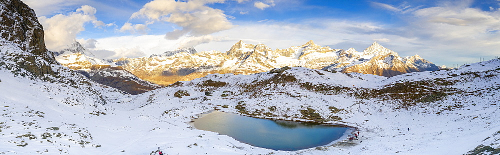 Aerial panoramic of Riffelsee lake surrounded by snow, Zermatt, canton of Valais, Swiss Alps, Switzerland, Europe