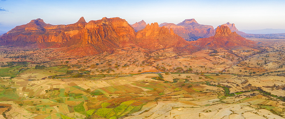 Cultivated fields at feet of the majestic Gheralta Mountains, aerial view by drone, Megab, Tigray Region, Ethiopia, Africa