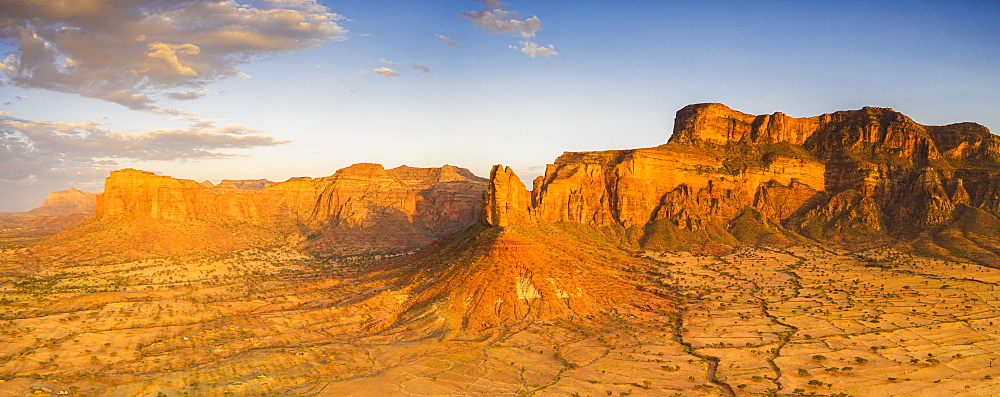 Aerial panoramic by drone of Gheralta Mountains lit by sunset, Hawzen, Tigray Region, Ethiopia, Africa