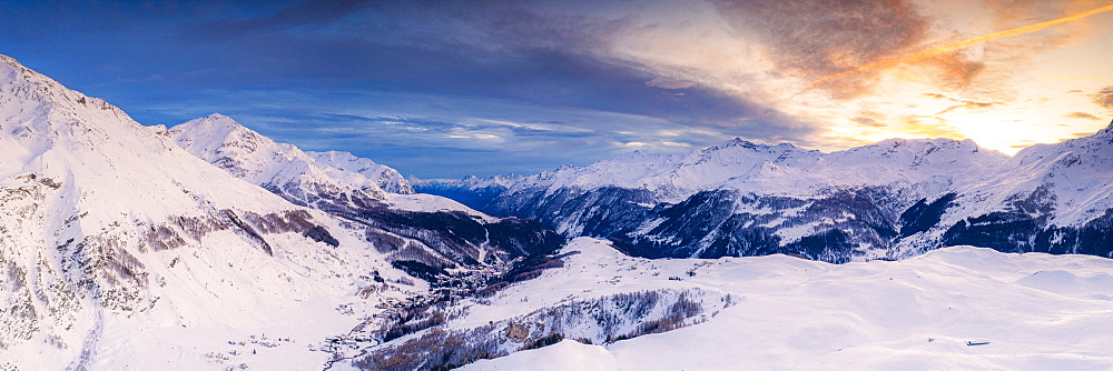 Aerial panoramic by drone of Madesimo and Andossi during a winter sunset, Valchiavenna, Valtellina, Lombardy, Italy, Europe