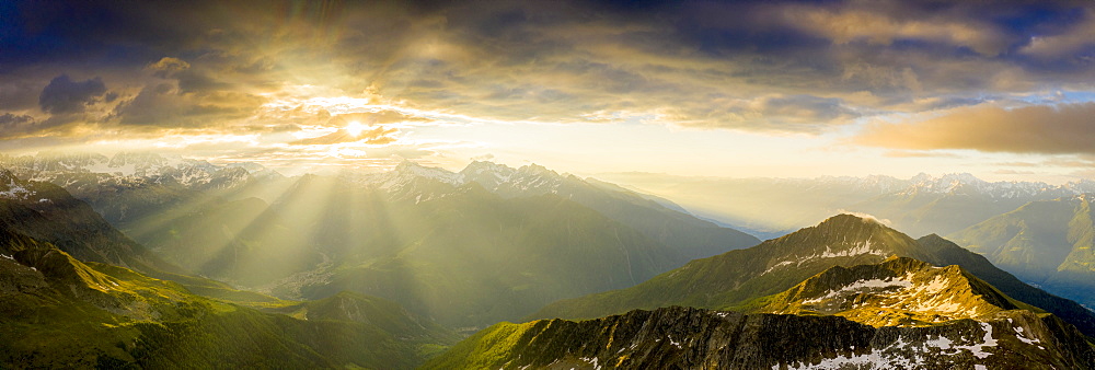 Aerial panoramic of Bernina mountain range and Pizzo Scalino lit by sunrise, Valmalenco, Valtellina, Lombardy, Italy, Europe