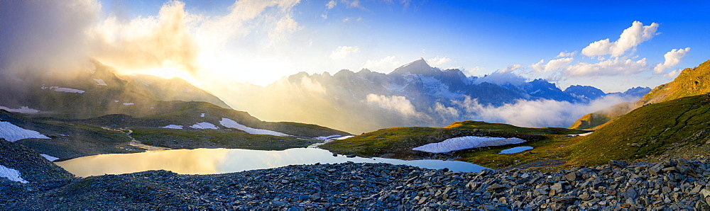 Sunrise over Mittleres Schwarziseeli lake and Galenstock mountain peak in background, Furka Pass, Canton Uri, Switzerland, Europe