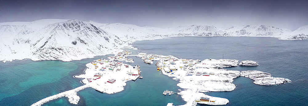 Aerial view of mountains and sea surrounding Sorvaer after a snow blizzard, Soroya Island, Troms og Finnmark, Arctic, Northern Norway, Scandinavia, Europe