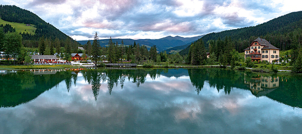 Panoramic of lake Dobbiaco at sunset in summer, Dobbiaco (Toblach), Dolomites, Bolzano province, South Tyrol, Italy, Europe