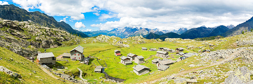 Stone huts and Rifugio Cristina surrounded by Rhaetian Alps, Alpe Prabello, Valmalenco, Valtellina, Lombardy, Italy, Europe