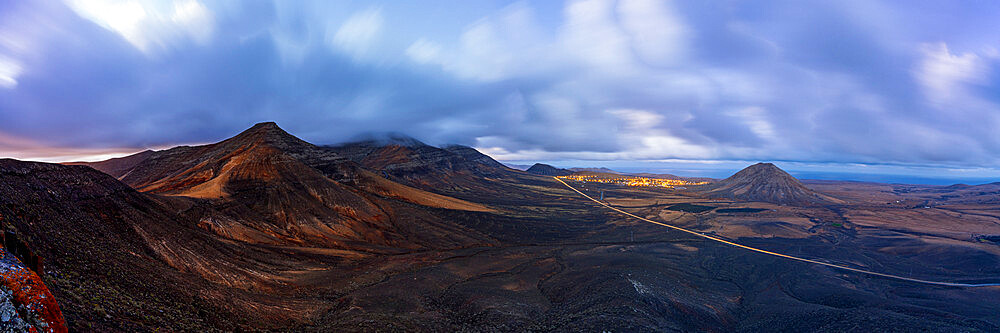 Dusk over the majestic Tindaya mountain and village in the desert landscape, La Oliva, Fuerteventura, Canary Islands, Spain, Atlantic, Europe