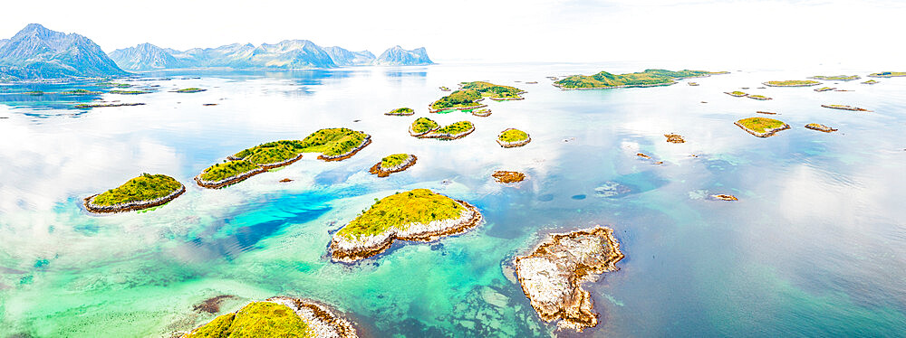 Aerial view of Bergsoyan Islands in the emerald transparent water of the fjord, Senja, Troms county, Norway, Scandinavia, Europe