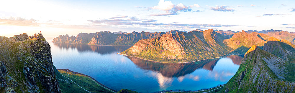 Husfjellet mountain reflected in the blue water of Ersfjord and Steinfjord fjords at sunset, aerial view, Senja, Troms, Norway, Scandinavia, Europe