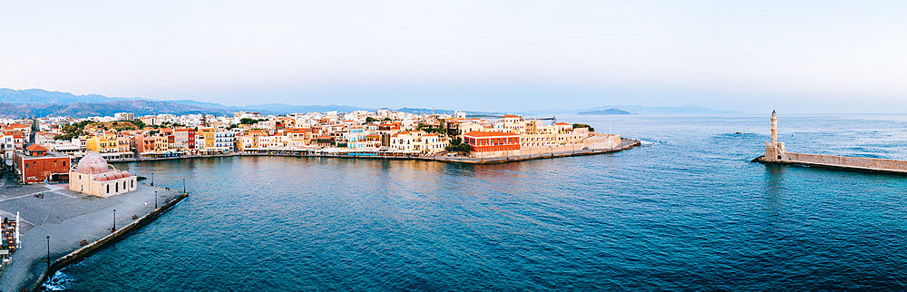 Panoramic of the old Venetian harbour and lighthouse of Chania at sunrise, aerial view, Crete, Greek Islands, Greece, Europe