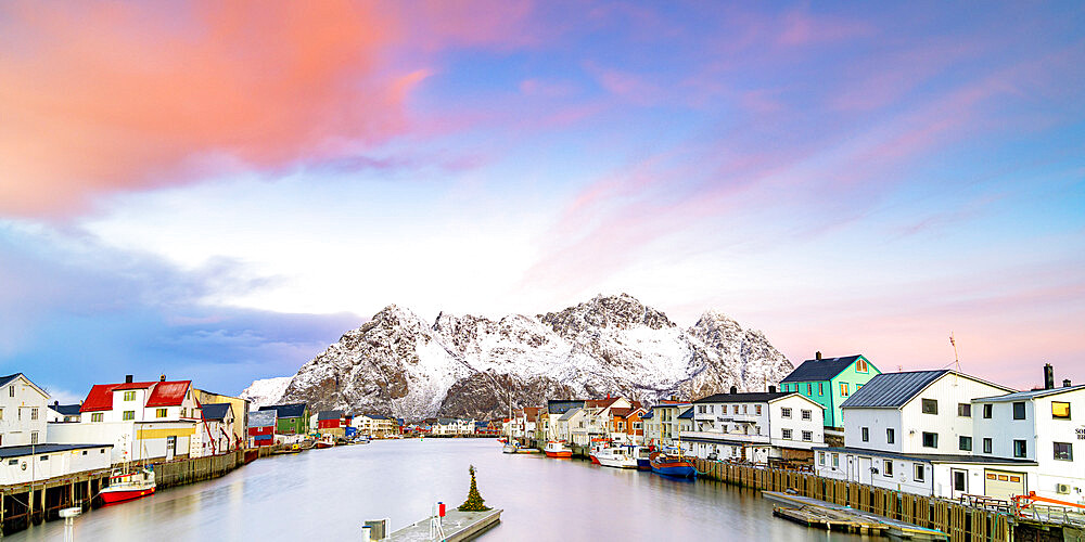 Pink Arctic sunrise over traditional houses in the fishing village of Henningsvaer in winter, Nordland, Lofoten Islands, Norway, Scandinavia, Europe