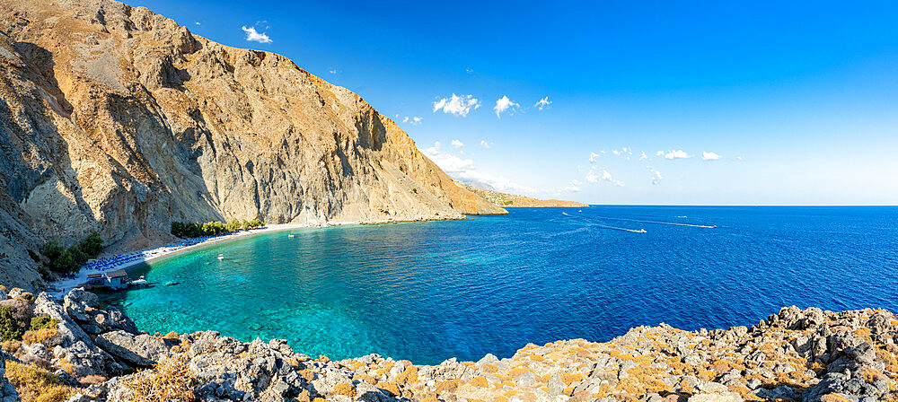 Panoramic view of white sand beach of Glyka Nera and crystal sea, Hora Sfakion, Crete island, Greek Islands, Greece, Europe