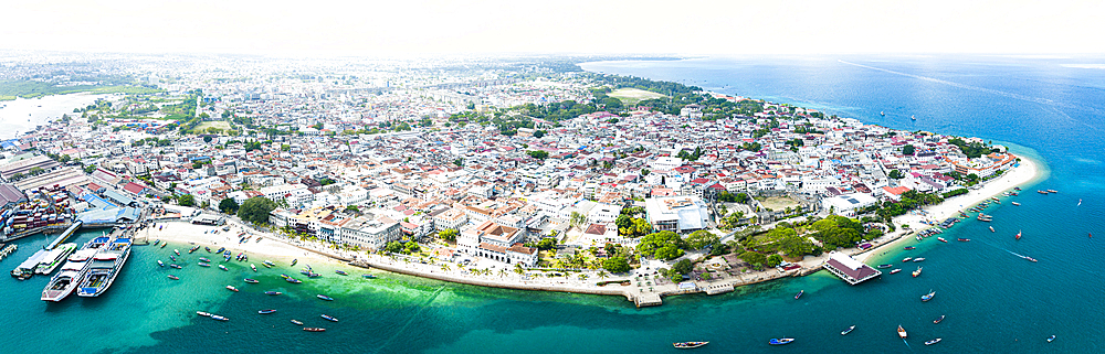 Aerial panoramic view of Stone Town and the clear water of the Indian Ocean, Zanzibar, Tanzania, East Africa, Africa