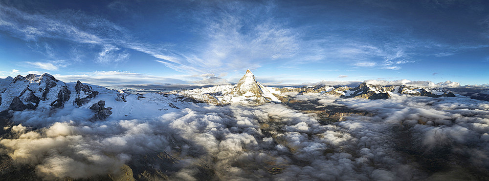 Aerial view of Matterhorn mountain peak in a sea of clouds at dawn, Zermatt, canton of Valais, Switzerland, Europe