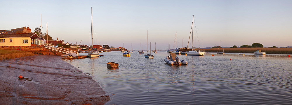 A warm view at sunset, at low tide on the estuary of the River Exe, at Topsham, Devon, England, United Kingdom, Europe