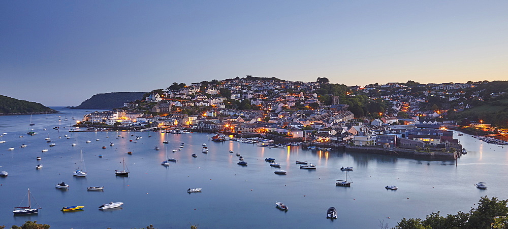 An atmospheric dusk view across the Salcombe village and estuary, on the south coast of Devon, England, United Kingdom, Europe