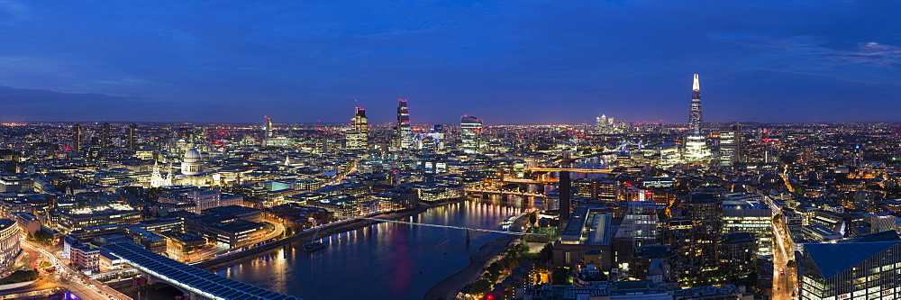 A night-time panoramic view of London and the River Thames from the top of Southbank Tower, showing The Shard and St. Paul's Cathedral, London, England, United Kingdom, Europe