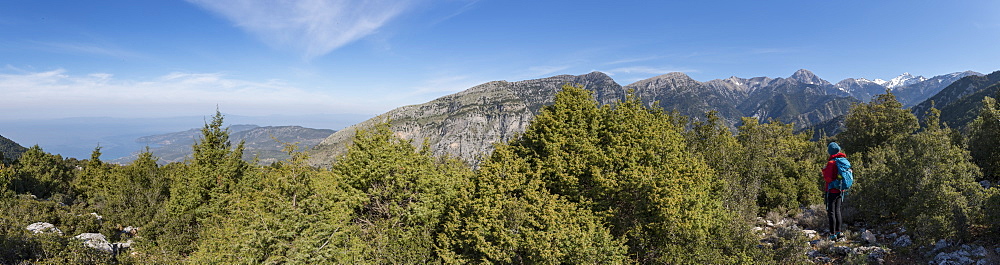 A woman trekking in the Taygetos mountains on the Mani Peninsula in the Peloponnese, Greece, Europe