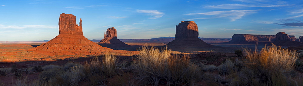 A panoramic image of the giant sandstone buttes at sunset in Monument Valley Navajo Tribal Park, Arizona, United States of America, North America