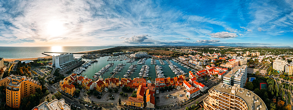 Aerial view of the tourist Portuguese town of Vilamoura, with yachts and sailboats moored in the port on the marina, Vilamoura, The Algarve, Portugal, Europe