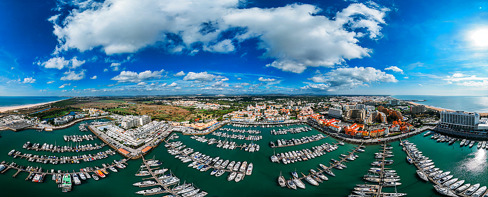 Aerial drone 360 degree panoramic view of Vilamoura Marina, Algarve, Portugal