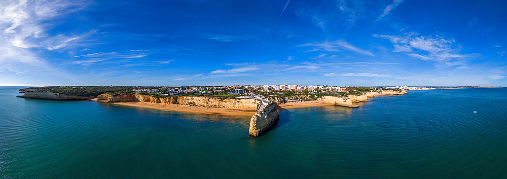 Aerial drone panoramic view of the Fort of Nossa Senhora da Rocha (also known as the Fort of Our Lady of the Rock or Castle of Porches), a medieval castle situated in the civil parish of Porches, in the municipality of Lagoa in Portuguese Algarve