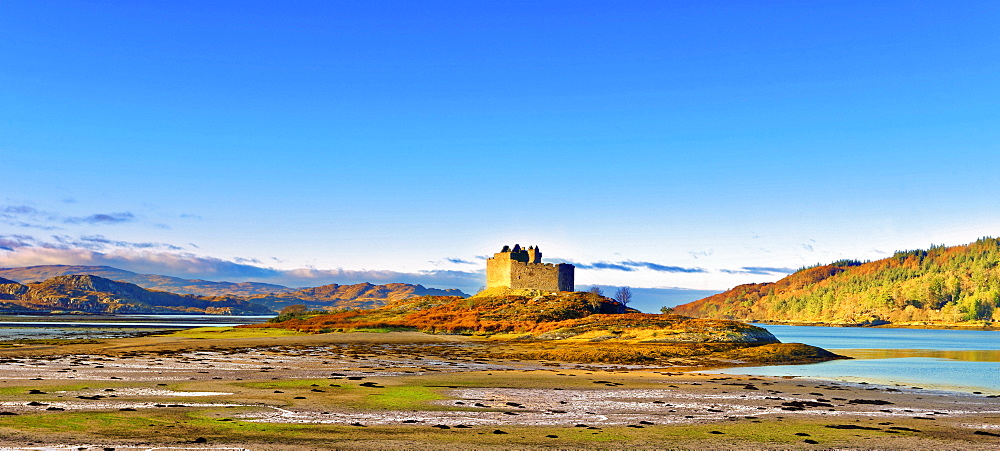 Castle Tioram on the coastal island Eilean Tioram where River Shiel and Loch Moidart meet, at low tide on a sunny winter morning, Highlands, Scotland, United Kingdom, Europe