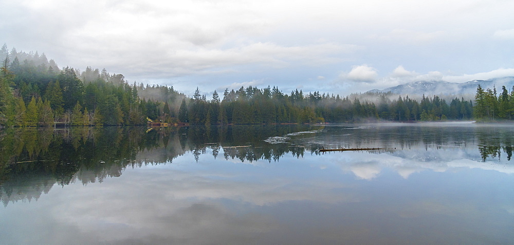 Mist over Garden Bay Lake with the Sunshine Coast Mountains in the background, British Columbia, Canada, North America