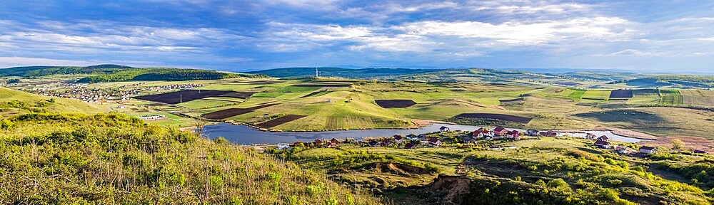 Panorama of Chinteni village and lake in summer, Romania, Europe