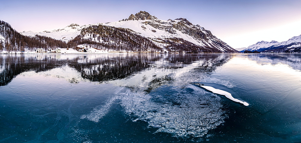 Panoramic view of the icy surface of Lake Sils at sunrise, Engadine Valley, Graubunden, Swiss Alps, Switzerland, Europe