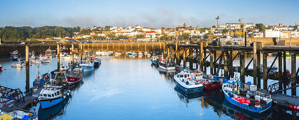 Boats in St. Peter Port Harbour at sunrise, Guernsey, Channel Islands, United Kingdom, Europe