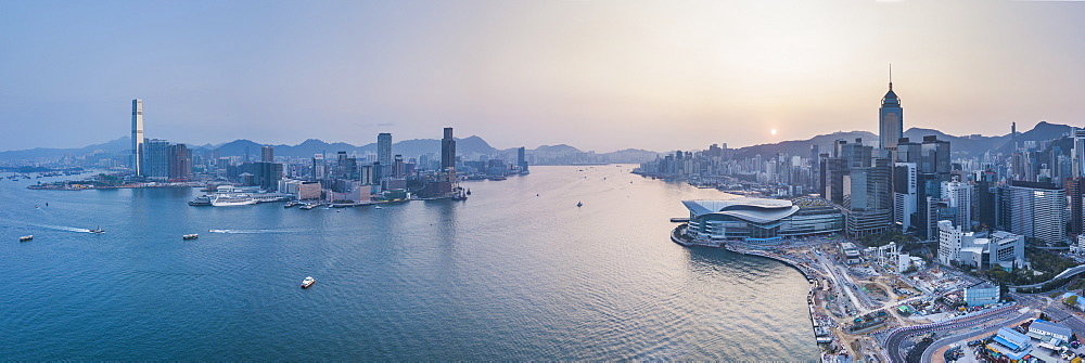 View over Victoria Harbour and Hong Kong at sunset, China, Asia