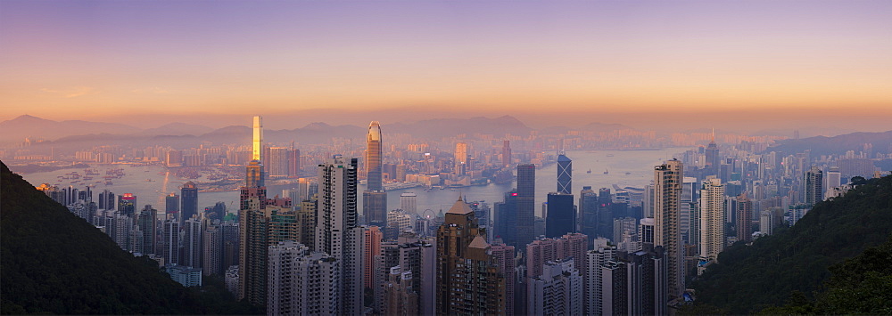 Hong Kong skyline at sunset, with a beautiful view of the Central CBD, Victoria Harbour, Kowloon cityscape, Hong Kong, China, Asia