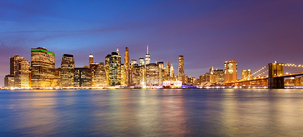 Lower Manhattan skyline and Brooklyn Bridge at dawn, New York City, New York, United States of America, North America