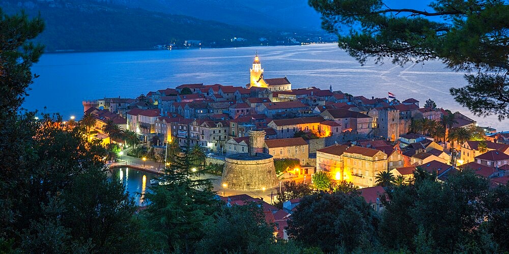 View over the Old Town at dusk, the illuminated cathedral prominent, Korcula Town, Korcula, Dubrovnik-Neretva, Dalmatia, Croatia, Europe