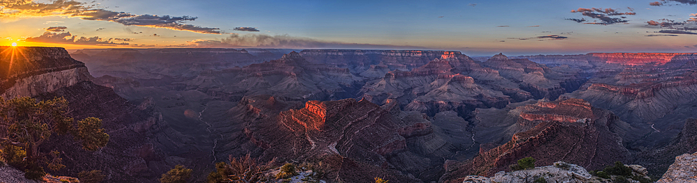 Smoke from the Dragon Bravo wildfire burning on the North Rim of Grand Canyon Arizona. Viewed from Shoshone Point on the South Rim. The fire started from a lightning strike on July 4th, 2025.