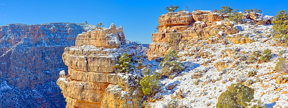 Ancient Indian ruins on a small rock island just left of center along the Palisades of the Desert at Grand Canyon Arizona.