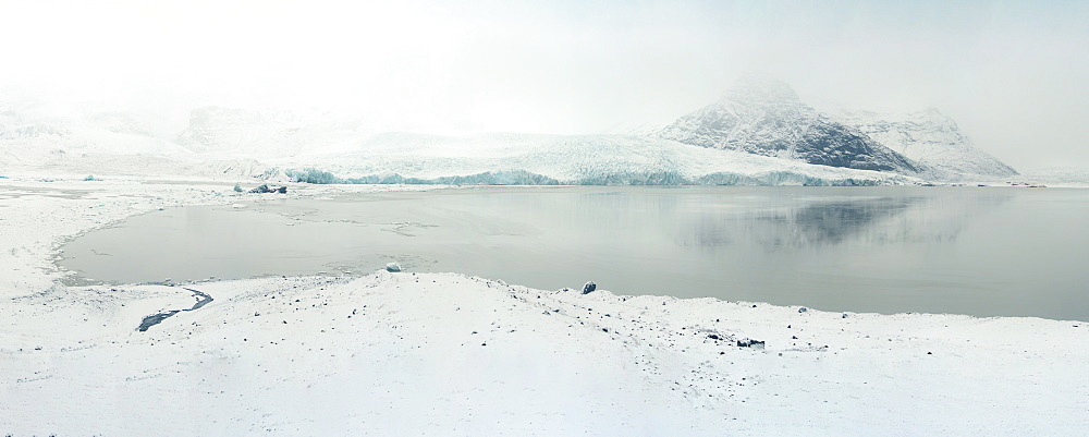 Fjallsarlon Ice Lagoon overlooking Fjallsjokull Glacier during snowstorm, Iceland, Polar Regions