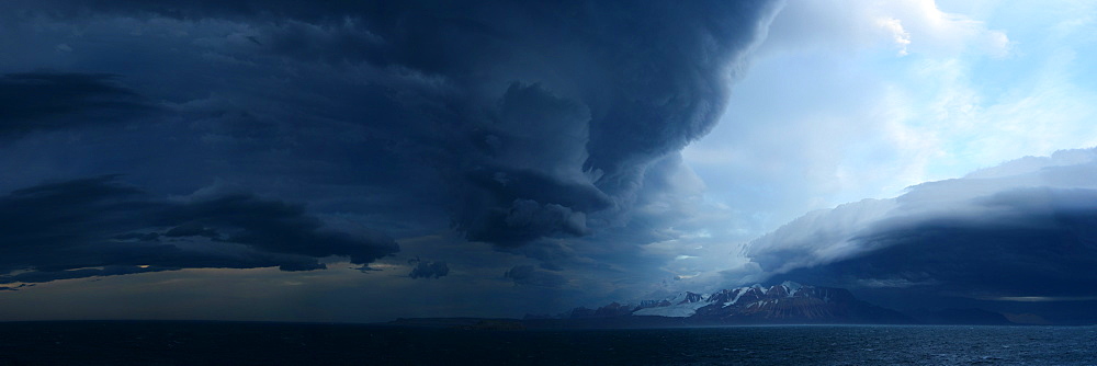 Panorama image of Lenticular clouds over the ocean, Nunavut and Northwest Territories, Canada, North America