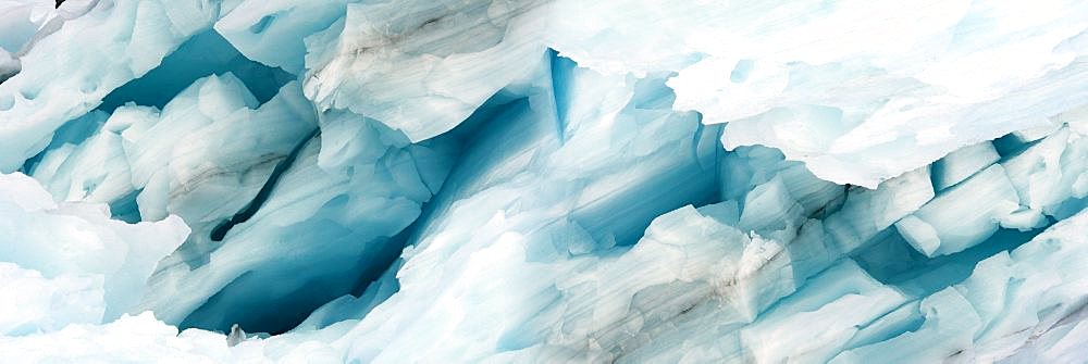 Panorama image of iceberg carved by wind and water