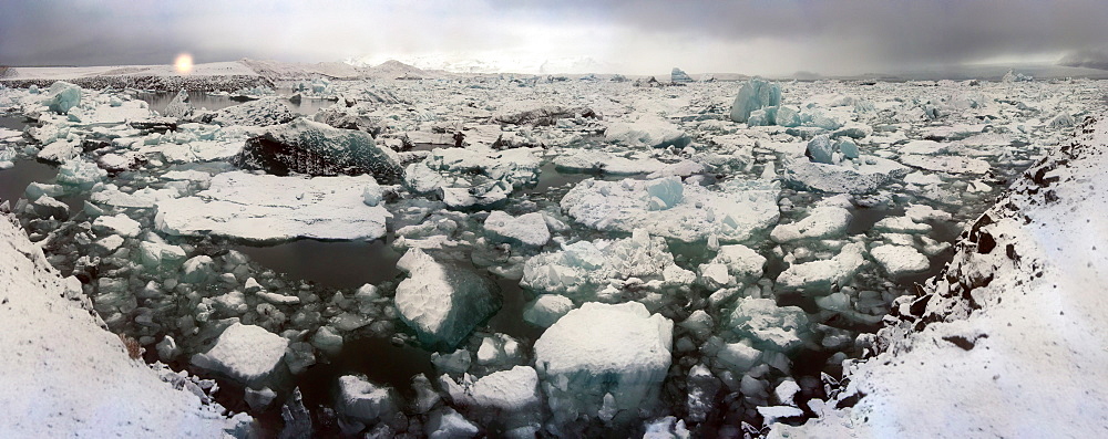 Icebergs from nearby glacier float in ice lagoon on its way to the sea, Iceland, Polar Regions