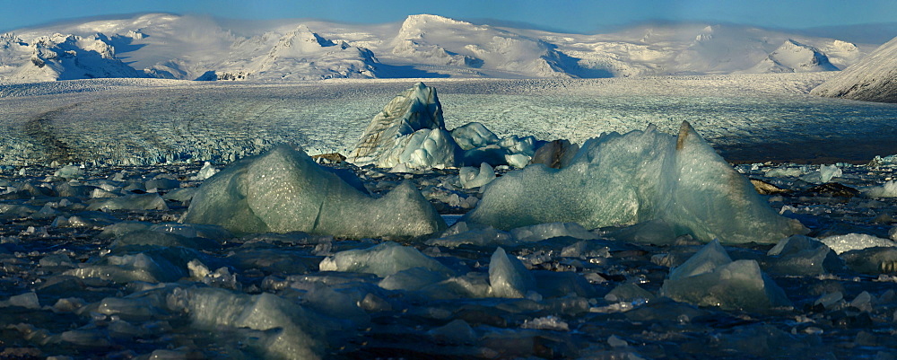 Icebergs from nearby glacier float in ice lagoon on its way to the sea, Iceland, Polar Regions