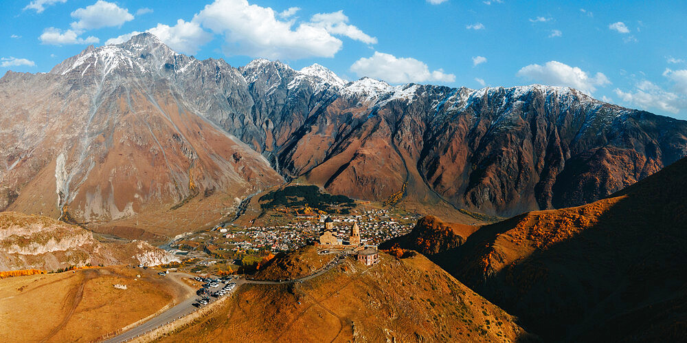 Fall view of Gergeti Trinity Church at sunset, Kazbegi, Georgia (Sakartvelo), Central Asia, Asia