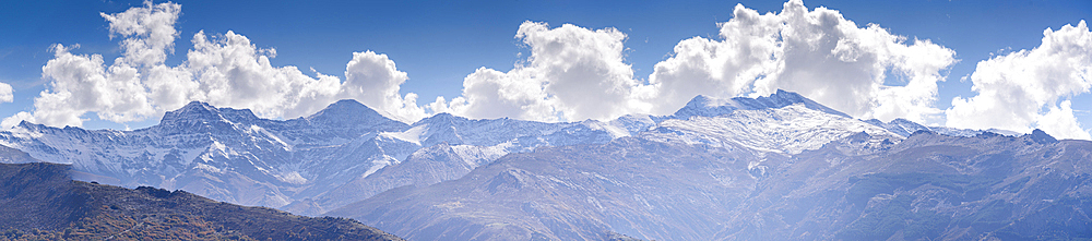 Panoramic view of the snowy sierra nevada with Alcazaba, Mulhacen and Pico de Veleta. View from Güejar Sierra, Sierra Nevada, Granada, Spain