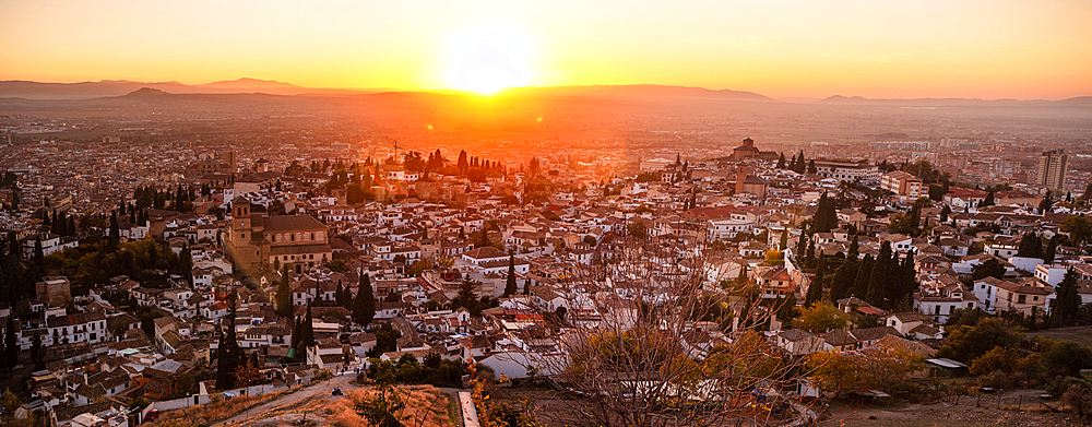 Vibrant red and orange sunset over the Albaicin, UNESCO, Granada, Andalucia, Spain