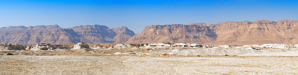 Panoramic view of Negev Desert with Orange sandstone mountains with a blue sky in Eilat, Israel