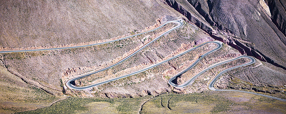 Winding mountain road with sharp bends, Purmamarca, Puna, Jujuy, Argentina
