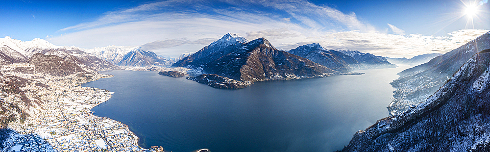 Aerial view of Monte Legnone and the snowy village of Dongo, Lake Como, Lombardy, Italy